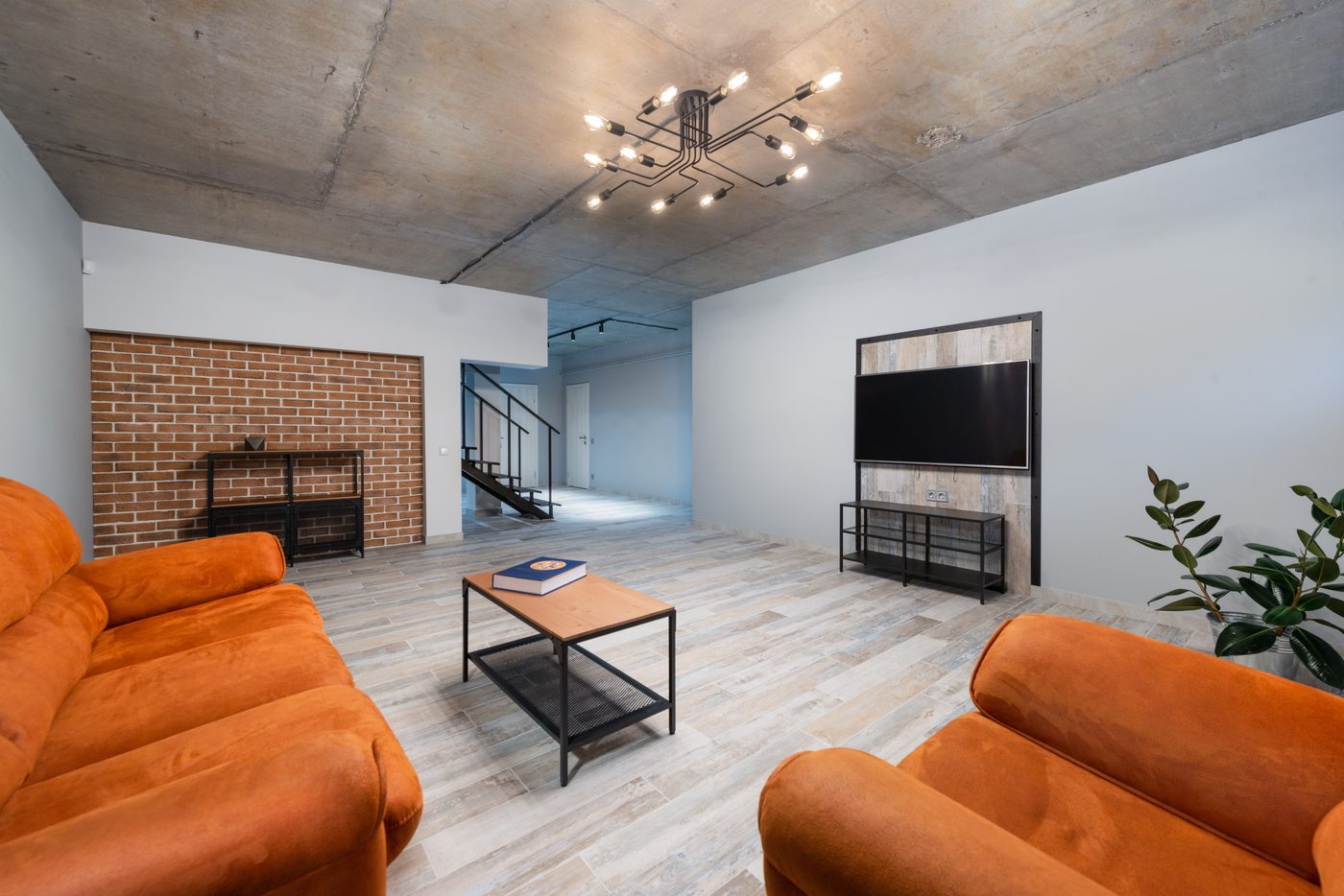 Finished basement living space with warm lighting
