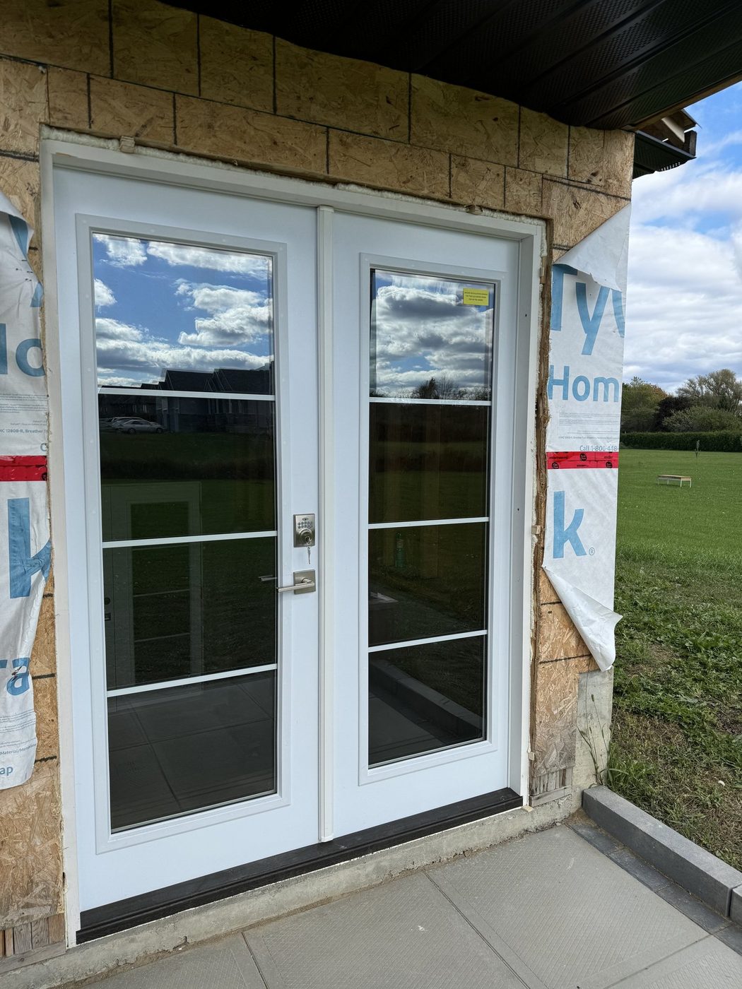 Warmly lit modern front entrance and door